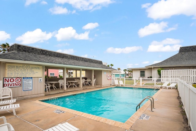 view of swimming pool featuring a patio