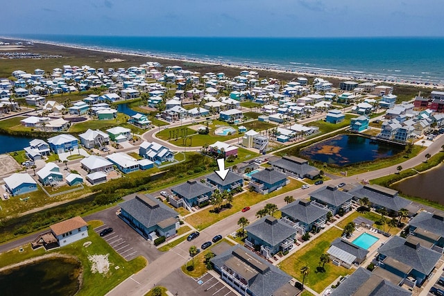 drone / aerial view with a view of the beach and a water view