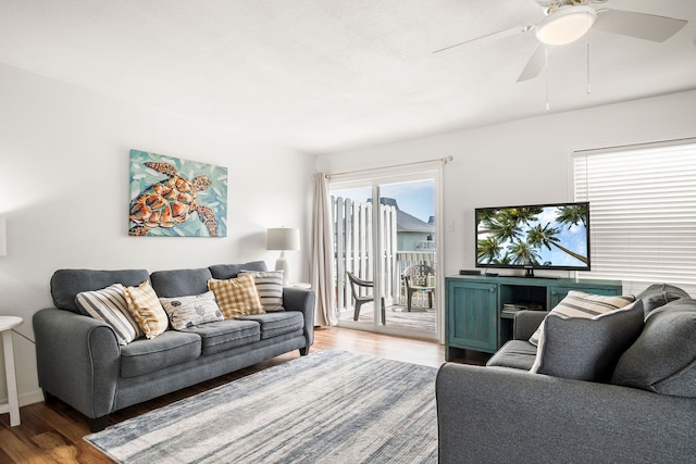 living room with hardwood / wood-style floors and ceiling fan