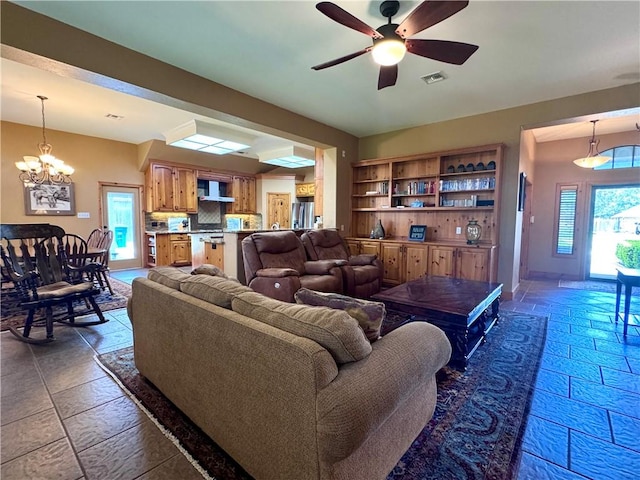7605 Bayonne Dr, Corpus Christi, TX 78414 - living room with stone tile floors, a chandelier, and ceiling fan