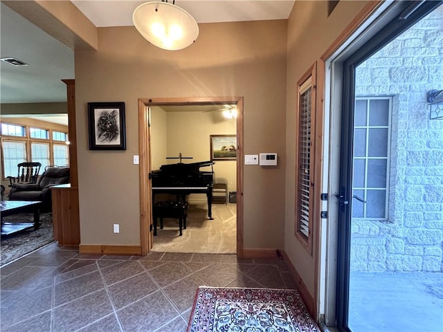 7605 Bayonne Dr, Corpus Christi, TX 78414 - corridor with baseboards and dark tile patterned flooring