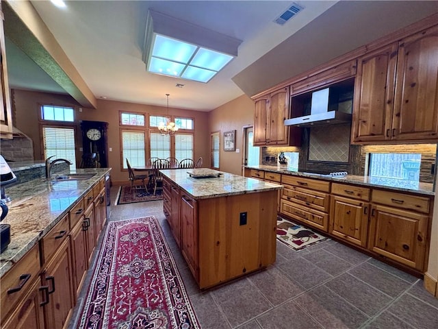 7605 Bayonne Dr, Corpus Christi, TX 78414 - kitchen with wall chimney exhaust hood, a chandelier, decorative backsplash, and black electric stovetop