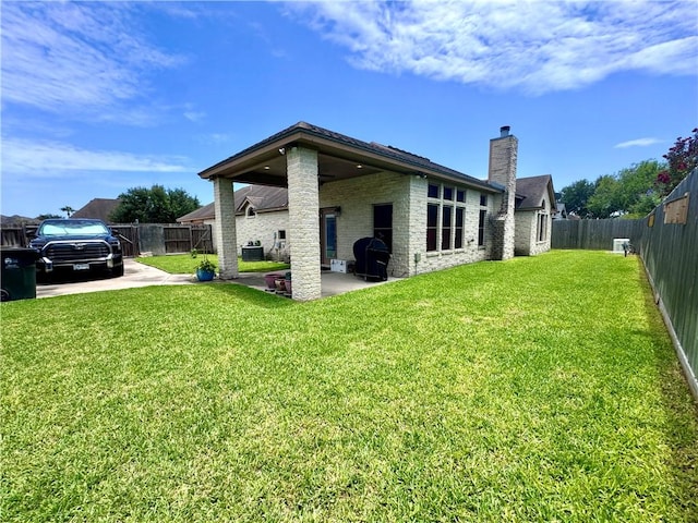 7605 Bayonne Dr, Corpus Christi, TX 78414 - rear view of property featuring a chimney, a fenced backyard, and a patio