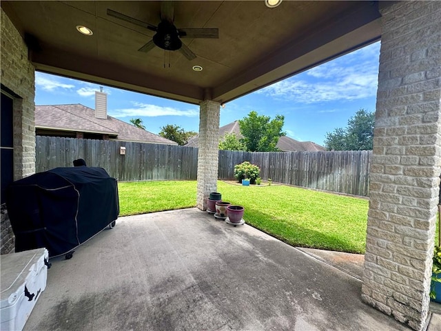 7605 Bayonne Dr, Corpus Christi, TX 78414 - fenced backyard featuring a ceiling fan, a patio area, and area for grilling