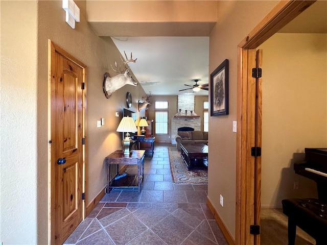 7605 Bayonne Dr, Corpus Christi, TX 78414 - hallway with baseboards and stone tile floors