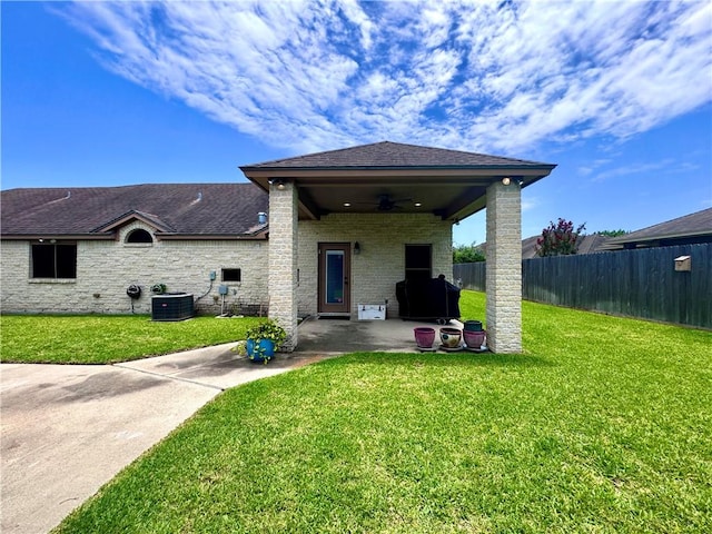 7605 Bayonne Dr, Corpus Christi, TX 78414 - rear view of house featuring ceiling fan, a patio area, a shingled roof, and brick siding