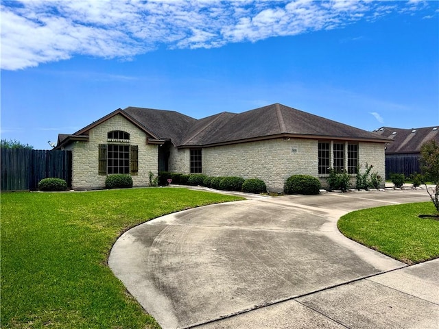7605 Bayonne Dr, Corpus Christi, TX 78414 - view of front of house with stone siding and curved driveway