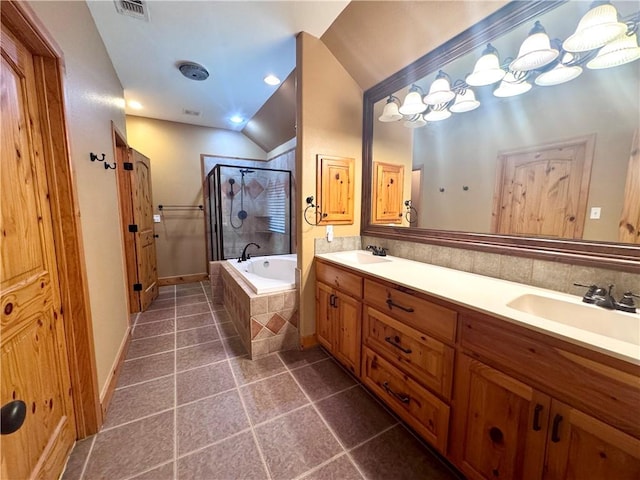 7605 Bayonne Dr, Corpus Christi, TX 78414 - full bathroom with vaulted ceiling, a shower stall, a garden tub, double vanity, and tile patterned floors