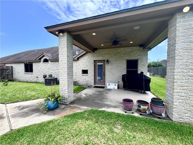 7605 Bayonne Dr, Corpus Christi, TX 78414 - fenced backyard with a ceiling fan, a patio, and area for grilling