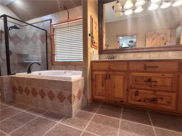 7605 Bayonne Dr, Corpus Christi, TX 78414 - full bathroom featuring a bath, vanity, a stall shower, tile patterned flooring, and a chandelier