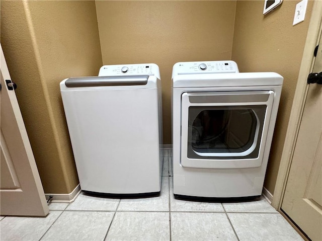 7605 Bayonne Dr, Corpus Christi, TX 78414 - laundry area featuring washing machine and dryer and light tile patterned flooring