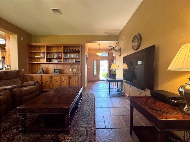 7605 Bayonne Dr, Corpus Christi, TX 78414 - living room featuring stone tile flooring and baseboards