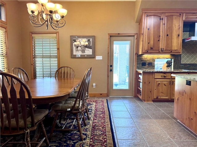 7605 Bayonne Dr, Corpus Christi, TX 78414 - dining space with a chandelier and baseboards