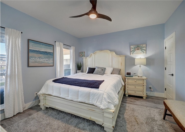 bedroom featuring ceiling fan and light hardwood / wood-style floors