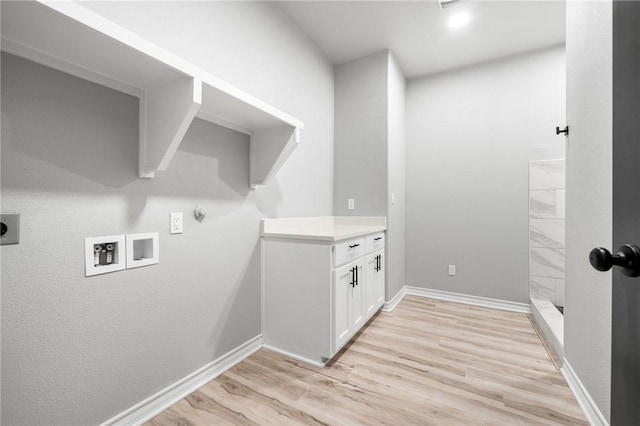 laundry room featuring hookup for a washing machine, light wood-style flooring, hookup for an electric dryer, laundry area, and baseboards