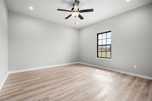 empty room featuring light wood finished floors, ceiling fan, baseboards, and recessed lighting