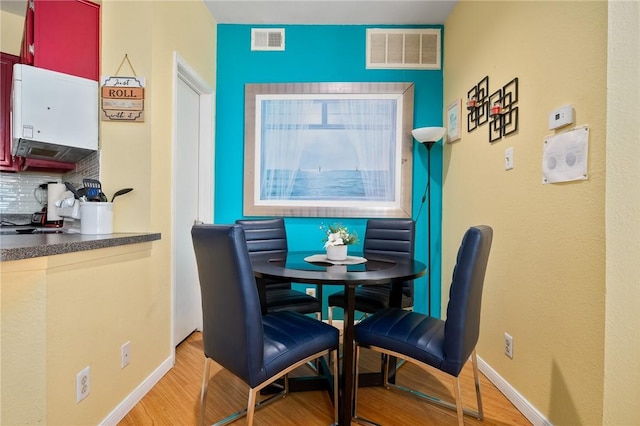 dining area with light wood-type flooring