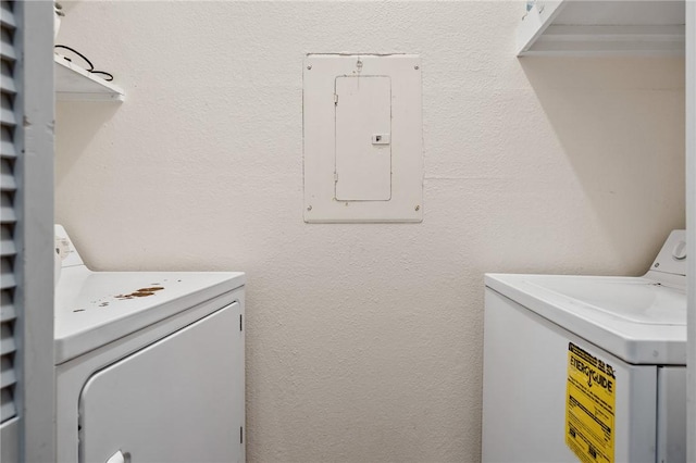 laundry area with washer and clothes dryer and electric panel