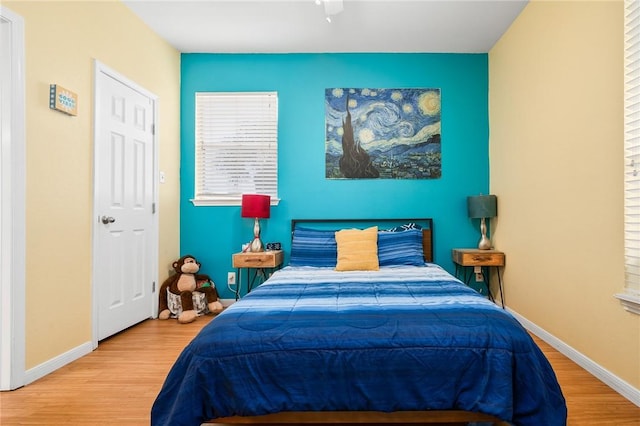 bedroom with hardwood / wood-style floors