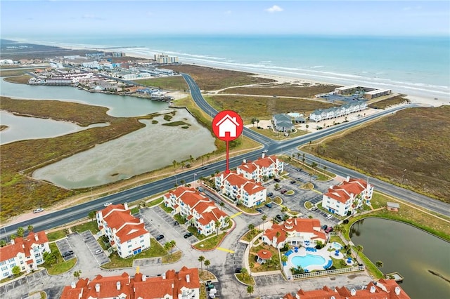 bird's eye view featuring a beach view and a water view