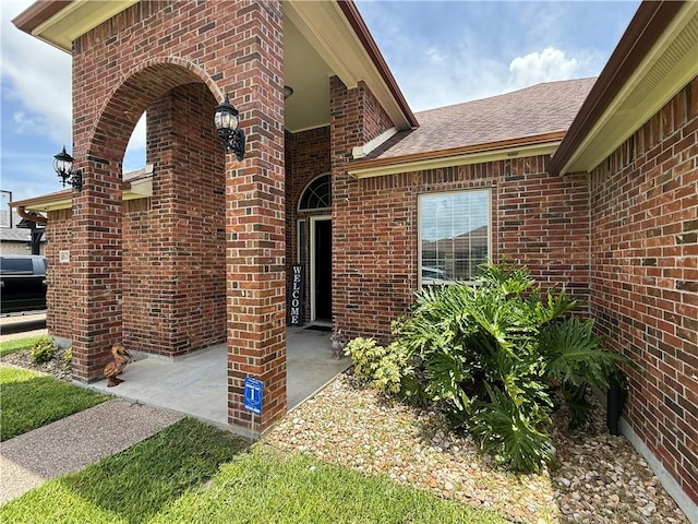 6717 Battery Park Ct, Corpus Christi, TX 78414 - entrance to property with brick siding and roof with shingles