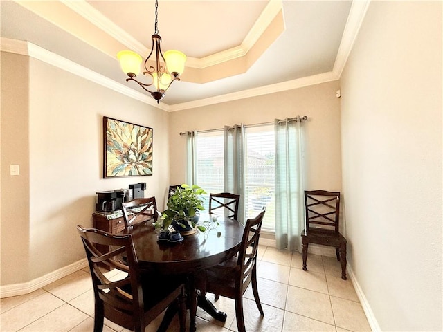 6717 Battery Park Ct, Corpus Christi, TX 78414 - dining area featuring light tile patterned flooring, a raised ceiling, a chandelier, and crown molding
