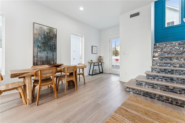 dining area with visible vents, stairs, light wood-style floors, baseboards, and recessed lighting