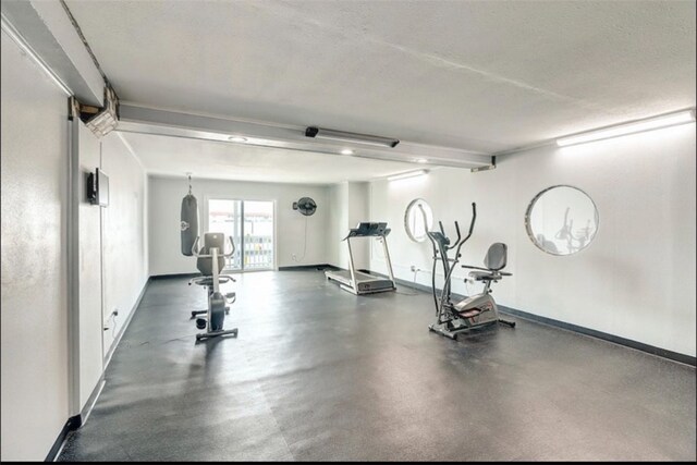 exercise room featuring a textured ceiling