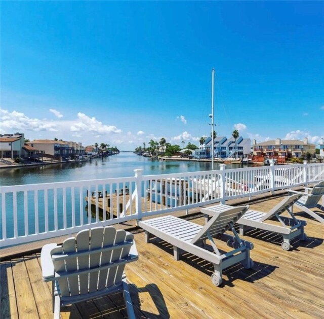 view of dock with a deck with water view