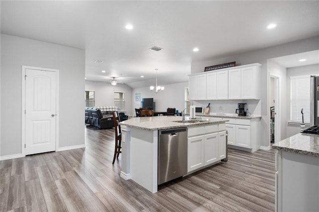 7218 Tristan, Corpus Christi, TX 78414 - kitchen featuring dishwasher, a sink, light wood-style flooring, open floor plan, and recessed lighting