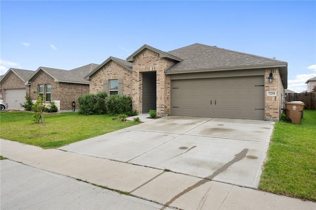 7218 Tristan, Corpus Christi, TX 78414 - single story home featuring brick siding, a garage, driveway, a shingled roof, and a front yard