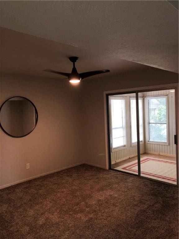 carpeted empty room with ceiling fan