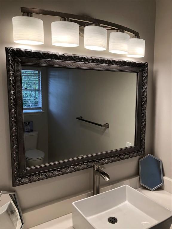 bathroom with sink and toilet