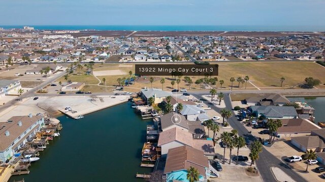 drone / aerial view featuring a residential view and a water view