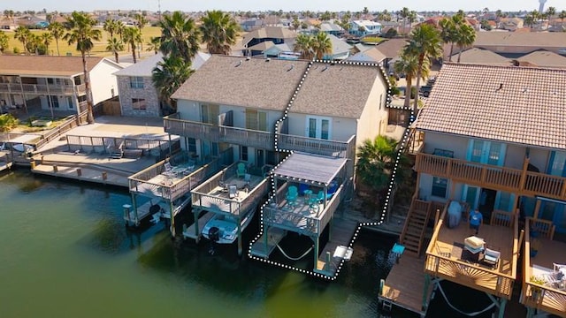 bird's eye view featuring a residential view and a water view