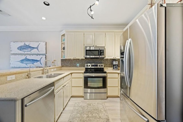 kitchen featuring crown molding, open shelves, decorative backsplash, appliances with stainless steel finishes, and a sink