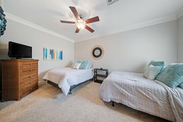 bedroom with a ceiling fan, visible vents, carpet flooring, and ornamental molding