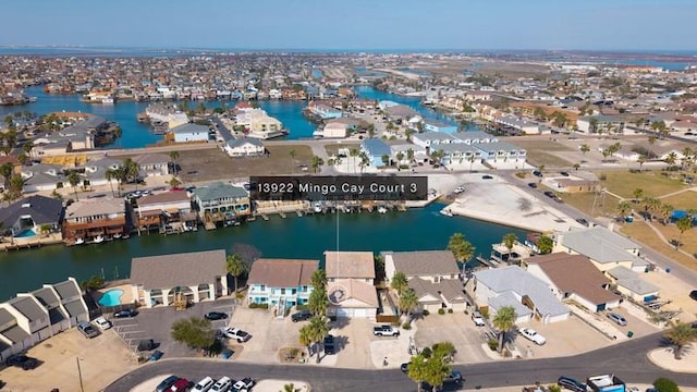 drone / aerial view with a water view and a residential view