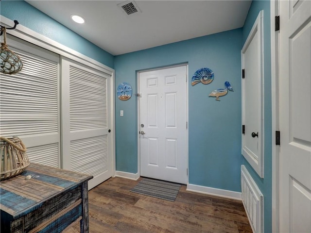 foyer entrance featuring dark hardwood / wood-style floors