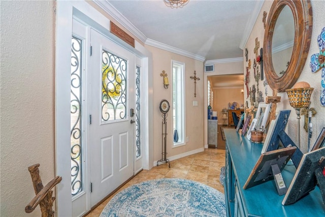 entryway with light tile patterned flooring and ornamental molding