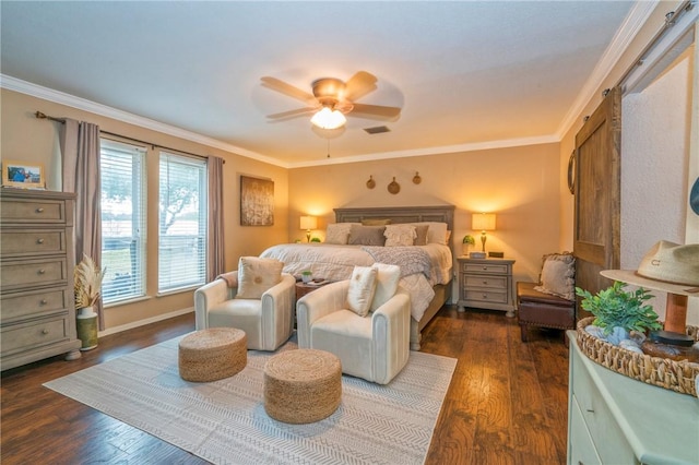 bedroom with a barn door, crown molding, ceiling fan, and dark wood-type flooring