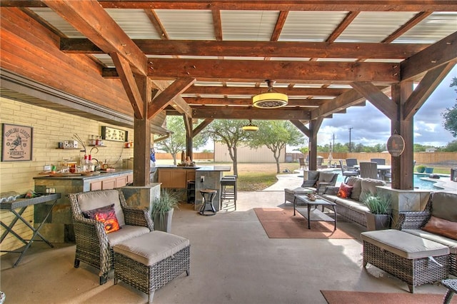 view of patio featuring outdoor lounge area and a bar