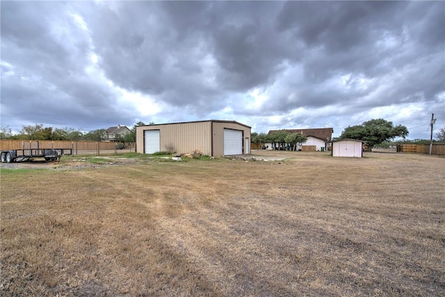 view of yard with an outbuilding and a garage