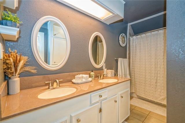 bathroom featuring a shower with curtain, tile patterned flooring, and vanity