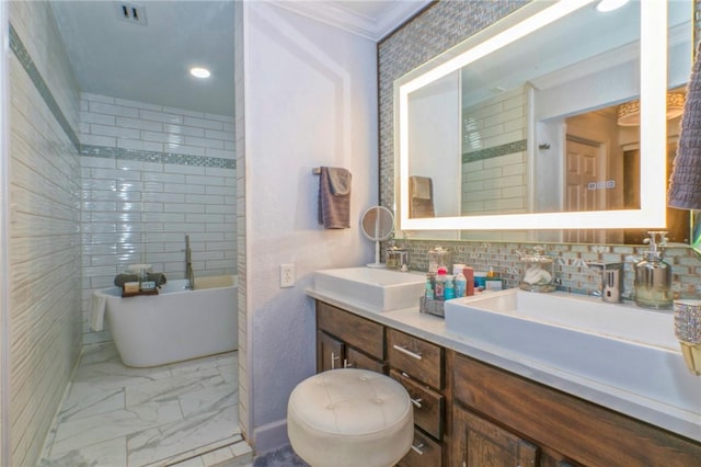 bathroom featuring vanity, ornamental molding, backsplash, and a bathing tub