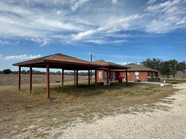 exterior space with a carport and a gazebo