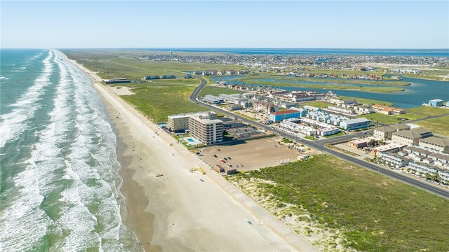 drone / aerial view featuring a view of the beach and a water view