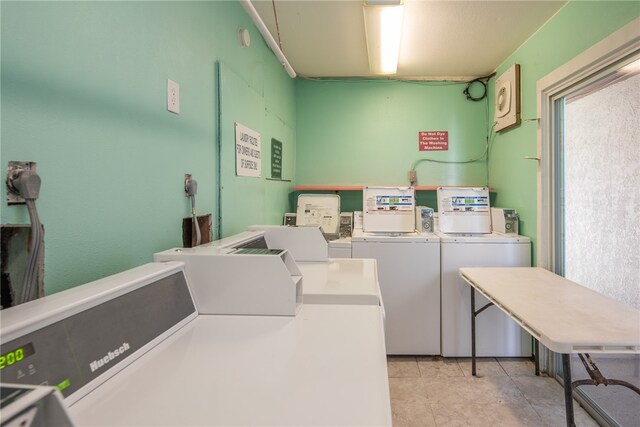 clothes washing area featuring washing machine and clothes dryer