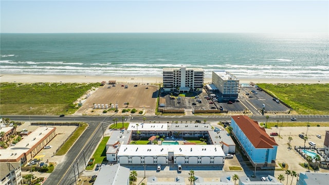 drone / aerial view with a beach view and a water view