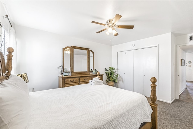 bedroom featuring ceiling fan, a closet, and carpet